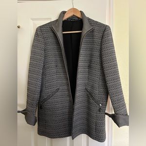“Ellen Tracy” tailored suit jacket. Zipper front and at sleeves. Size 14.